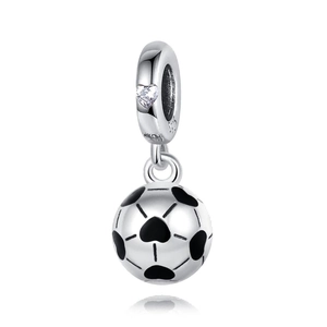 Macro shot of 925 sterling silver football pendant with black hearts and crystal accent