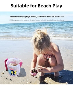 Detailed view of child beach mesh bag with blue fish pattern and shell storage space