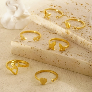 Minimalist gold adjustable rings set featuring butterfly, heart, and zircon designs