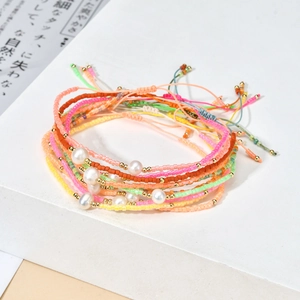 Bohemian seed bead bracelet set with freshwater pearls and adjustable gold accents