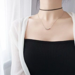 Double-layered necklace set featuring a black woven choker and six sliding silver beads