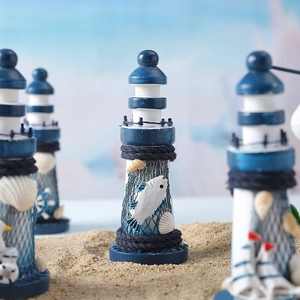 Mediterranean style wooden lighthouse ornament with fishnet and shell decorations