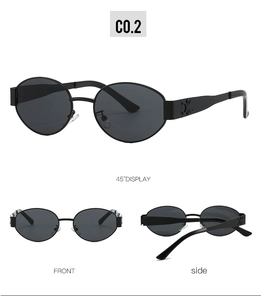 Detail view of oval sunglasses with metallic gold emblem on matte black frame