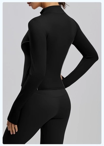 Detail view of black yoga jacket with reflective side strips and slim fit stand collar