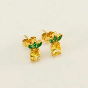 Detailed close-up of pineapple stud earrings with yellow and green zircon stones