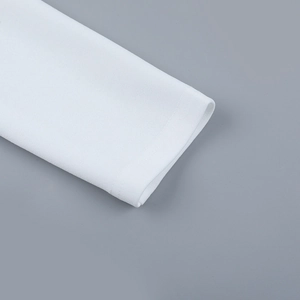 Close-up of white long-sleeved dress cuff featuring neat stitching and fine fabric texture