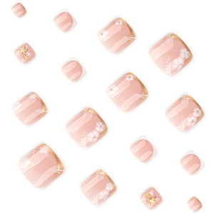 Faux ongles d'orteils style français à bord doré avec fleurs blanches et perles