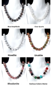 Detailed view of faceted natural stone necklaces including quartz and unakite textures