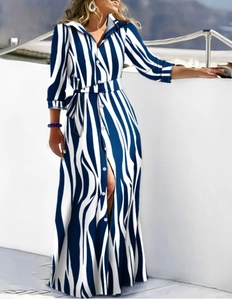 Detail of blue and white zebra striped long-sleeved shirt dress with matching waist belt