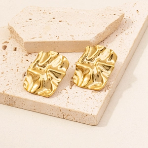 Detail of 18k gold plated 304 stainless steel earrings with irregular wrinkled texture