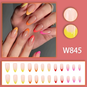 Colorful almond-shaped French press-on nails with yellow, orange, red, and pink tips