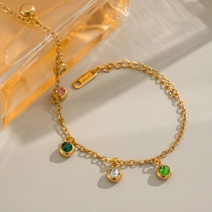 18K gold plated stainless steel bracelet with colorful zircon charms on perfume bottle