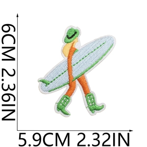 Detailed view of surfer embroidery patch showing green wave and board measurements
