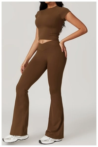 Detail of V-shaped high waist and flared legs on dark brown yoga fitness set for women