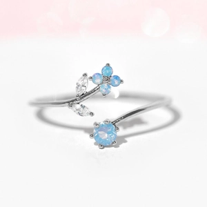 Blue floral silver open ring for women with cubic zirconia petals and leafy accents