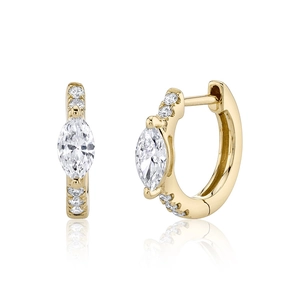 Macro shot of 14K gold marquise diamond earrings with luxury side stone detailing