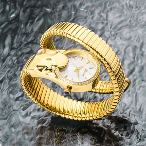 Detail of gold snake-shaped wrap bracelet watch featuring crystal-set round white dial