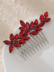 Detail of red marquise crystal leaf bridal hair comb on silver base with a polished finish