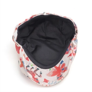 Detail view of the vintage beret hat featuring breathable black inner lining and red graffiti
