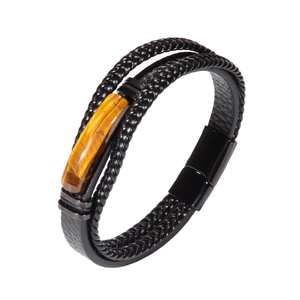 Close-up of multilayer leather bracelet for men with tiger eye stone and magnetic clasp
