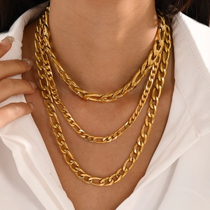 Three-layer gold-plated stainless steel Cuban link necklace worn by a fashion model