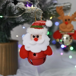 Plush Santa Claus ornament with a red star bell hanging on a festive Christmas tree