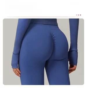 Close-up of seamless dark blue yoga leggings featuring a scrunch butt lifting design