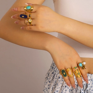 Bohemian gold stainless steel rings set with turquoise and lapis lazuli on model hands