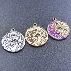 Detailed relief of mushroom and moon patterns on gold, silver, and rainbow metal pendants
