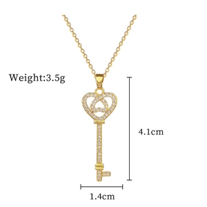 Detailed size view of luxury gold heart key necklace with sparkling stones and chain dimensions