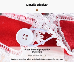Macro shot of red felt Christmas curtain buckle with white lace trim and button detail