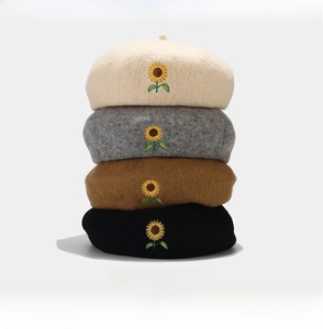Detailed knit wool berets featuring sunflower embroidery in beige, grey, brown, and black