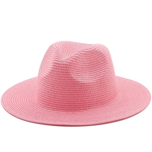 Pink straw panama hat for women featuring a wide brim and classic fedora crown for summer