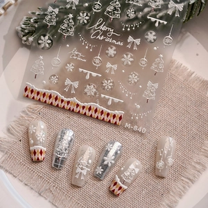 3D embossed Christmas nail stickers M840 with snowflake and plaid patterns on linen background