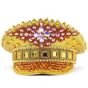 Sparkly gold sequin captain hat with rhinestone star and red gems for festive party