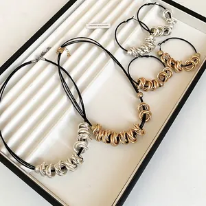 Minimalist gold and silver twisted circle pendant necklace and hoop earring jewelry set