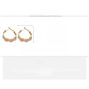 Detail showing rose gold spiral hoop earring dimensions with weight and material specs
