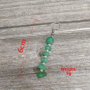 Detail of 6cm long green stone fringe earrings weighing 5g with silver metal beads