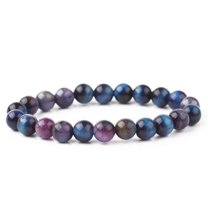 Macro shot of natural blue tiger eye stone bracelet with glossy mineral texture beads