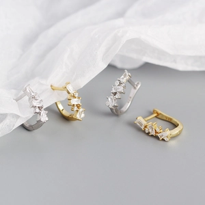 Close-up of S925 sterling silver U-shaped hoop earrings with gold and silver finish