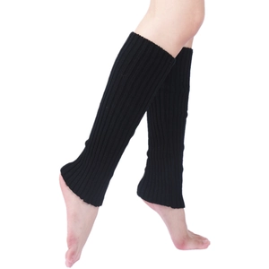 Detail of black knit leg warmers showing elastic ribbed texture and heel opening