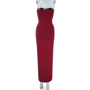 Detail of burgundy tube maxi dress featuring ruched bodice and slim fit silhouette
