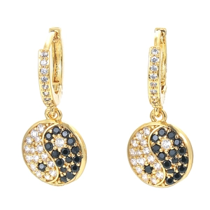 Golden huggie hoop earrings with Yin Yang pendants and sparkling crystal zircon inlay