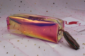Macro shot of colorful tassel zipper and holographic laser texture on pencil case