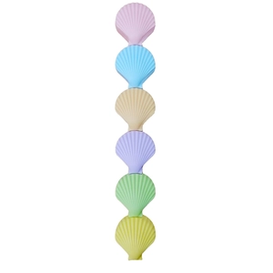 Close-up of shell-shaped stackable cases in pink blue beige purple green and yellow