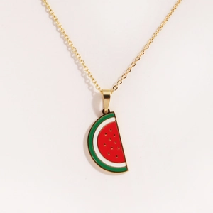 Detail view of gold-plated titanium necklace featuring a red enamel watermelon pendant