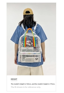 Clear PVC backpack with colorful rainbow straps shown on model for size perspective