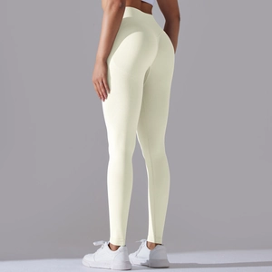 Detailed close-up of seamless ribbed high waist yoga pants with V-shaped peach butt lifting design