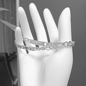 Polished silver stainless steel ID chain bracelet on model with curved metal plate