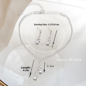 Detail view of silver tassel bridal jewelry set showing necklace and earring dimensions